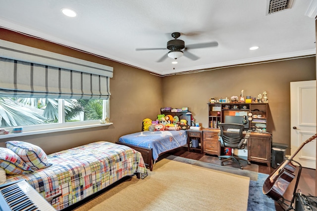 bedroom with ceiling fan and ornamental molding