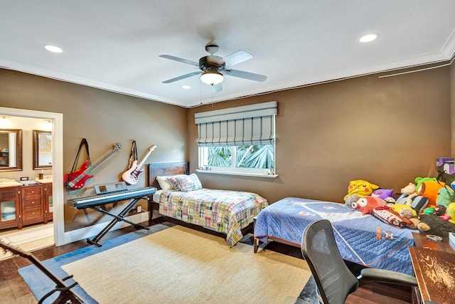 bedroom with connected bathroom, ceiling fan, ornamental molding, and hardwood / wood-style flooring