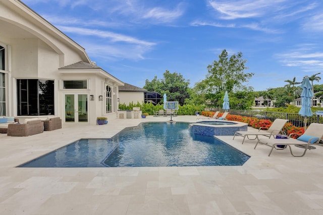 view of pool with a patio area, an outdoor hangout area, an in ground hot tub, and french doors