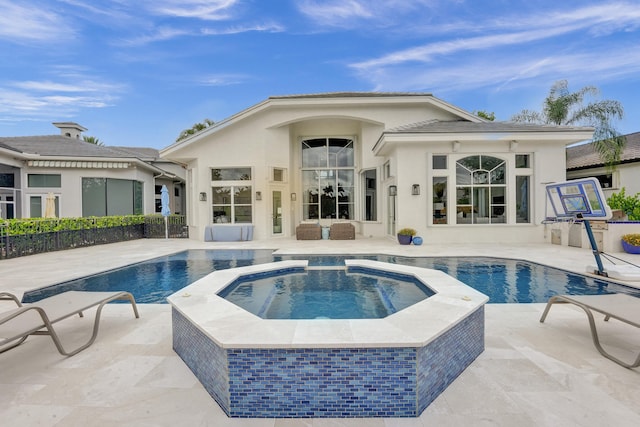 view of swimming pool with an in ground hot tub, an outdoor living space, and a patio area