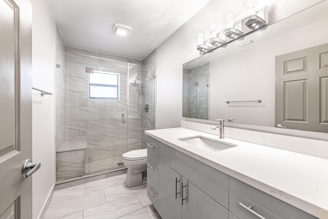 bathroom featuring vanity, toilet, and walk in shower