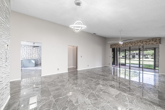 interior space with a textured ceiling, ceiling fan, and lofted ceiling