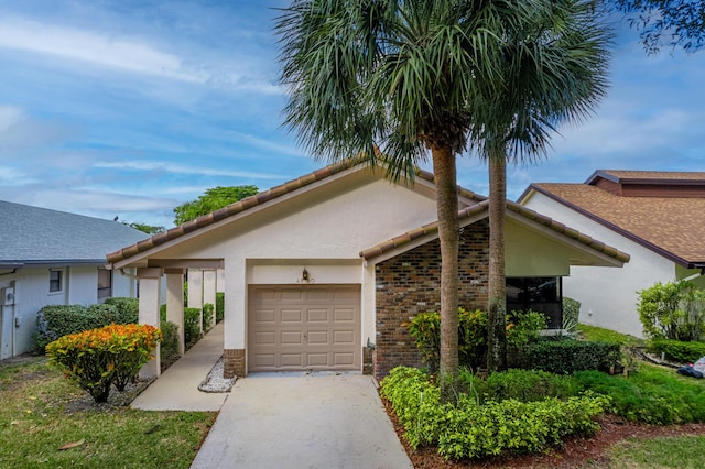 ranch-style home featuring a garage