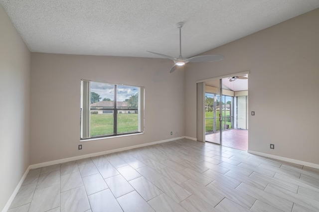 unfurnished room with ceiling fan, a healthy amount of sunlight, and a textured ceiling