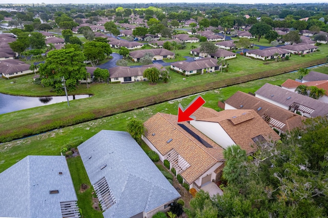 birds eye view of property featuring a water view