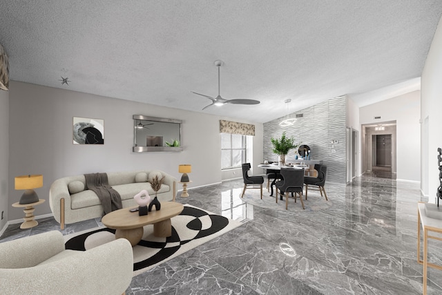 living room featuring ceiling fan, a textured ceiling, and vaulted ceiling