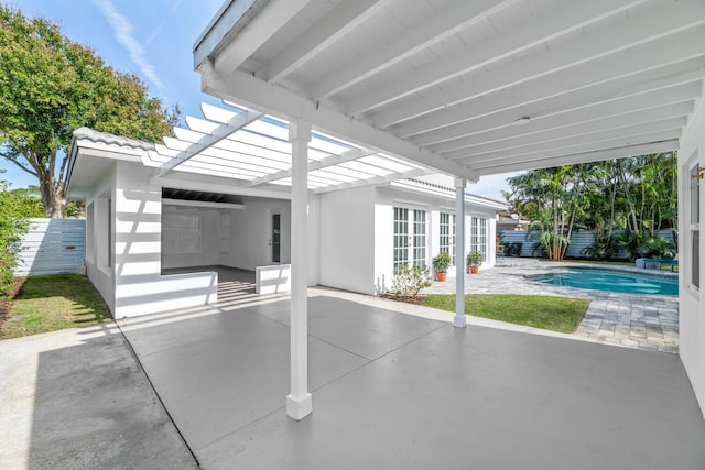 view of patio / terrace featuring a fenced in pool and a pergola