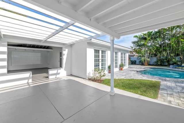 view of patio / terrace featuring a fenced in pool, a pergola, and french doors