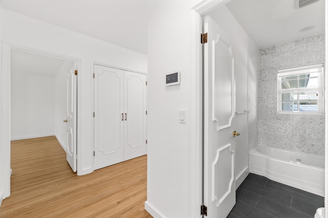 corridor with wood-type flooring