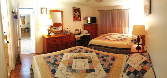 bedroom with hardwood / wood-style floors and ceiling fan