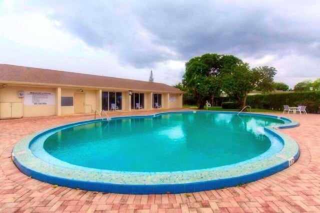 view of pool featuring a patio area