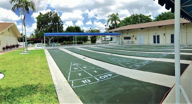 surrounding community featuring a lawn