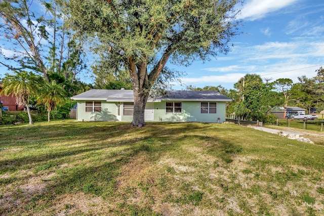 single story home featuring a front yard