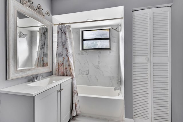 bathroom featuring shower / bath combo with shower curtain and vanity