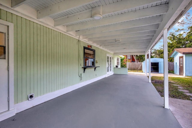 view of patio / terrace featuring a storage shed