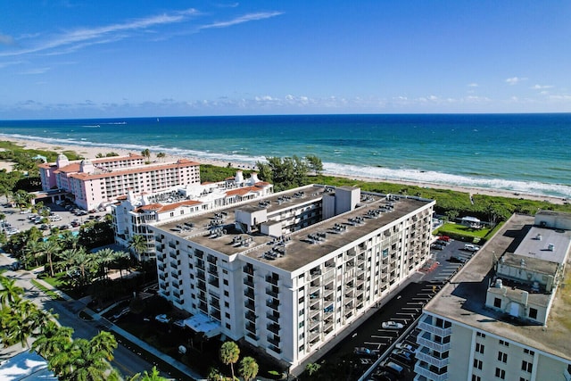 bird's eye view featuring a water view and a view of the beach