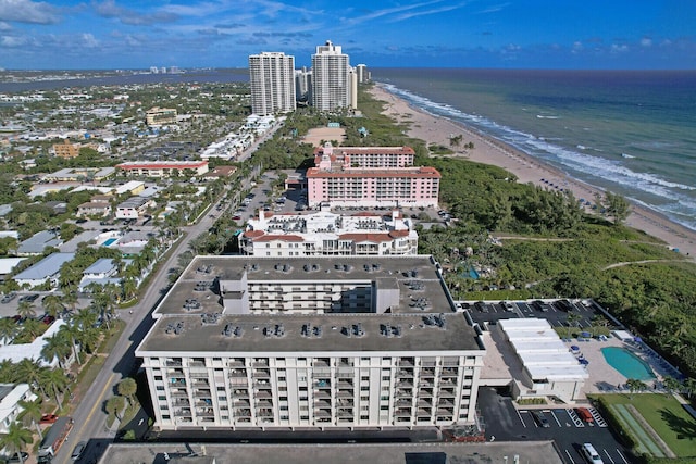 bird's eye view featuring a view of the beach and a water view