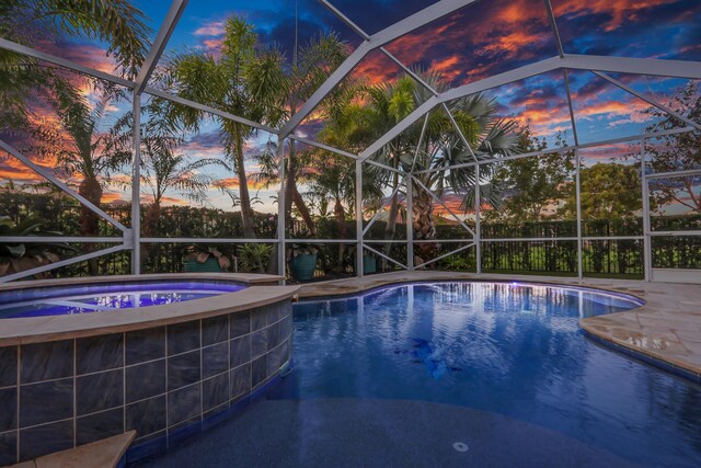 view of pool at dusk