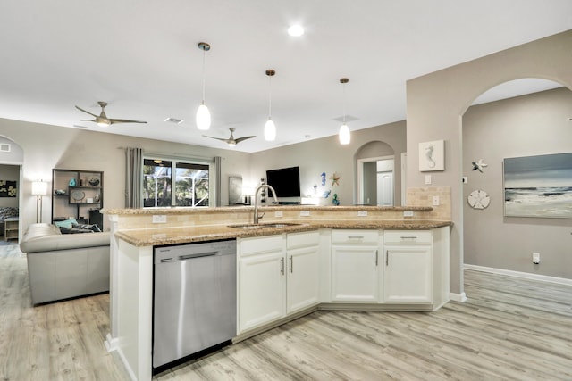 kitchen with white cabinetry, stainless steel appliances, decorative light fixtures, and kitchen peninsula