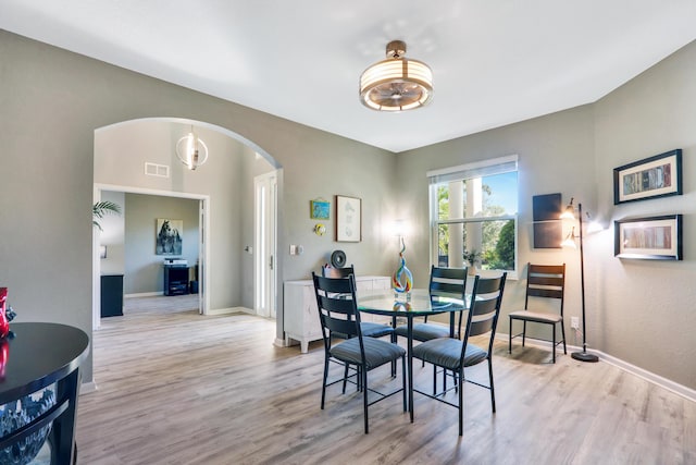 dining area with light hardwood / wood-style flooring