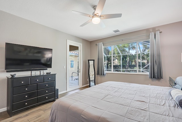 bedroom with ceiling fan and light wood-type flooring