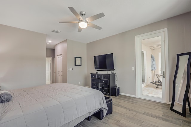 bathroom featuring plus walk in shower, hardwood / wood-style floors, and vanity