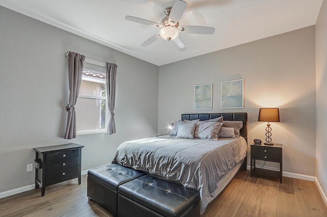 bedroom featuring hardwood / wood-style flooring and ceiling fan