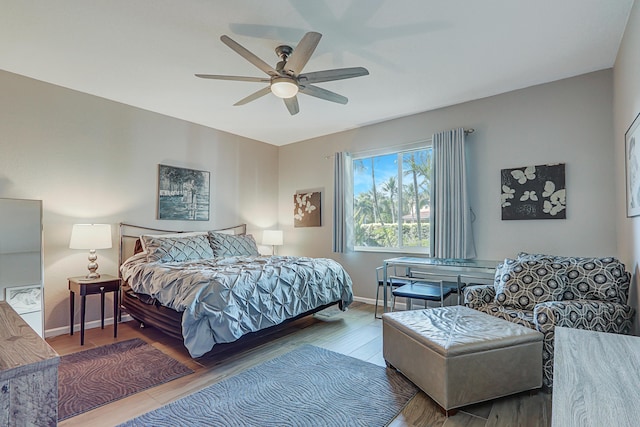 bedroom featuring hardwood / wood-style flooring and ceiling fan