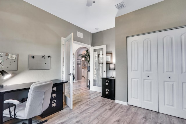 office with light hardwood / wood-style flooring and ceiling fan