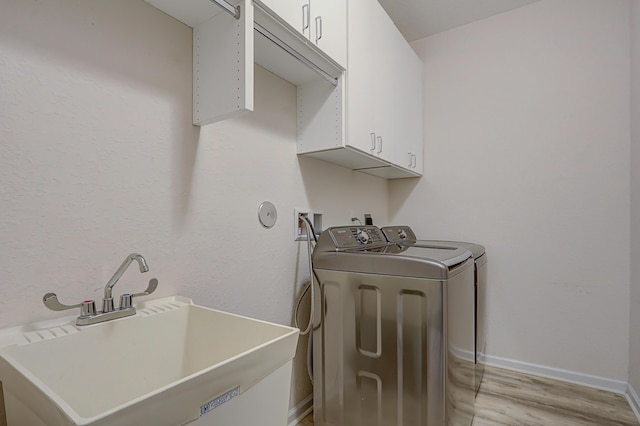 garage featuring a garage door opener, stainless steel fridge, and electric panel