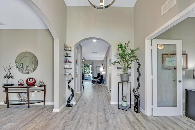 kitchen featuring white cabinetry, appliances with stainless steel finishes, light stone countertops, and sink