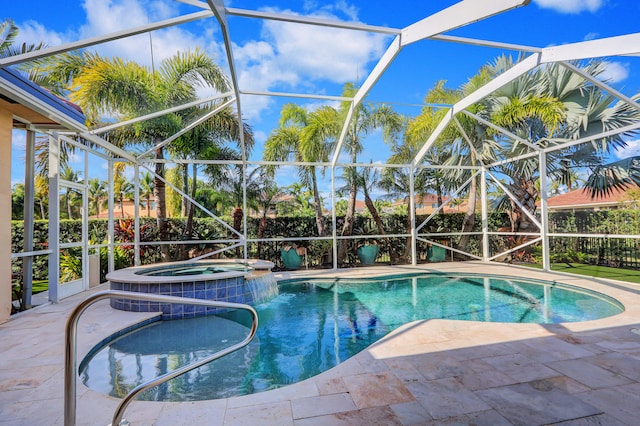 view of pool with an in ground hot tub, a patio, and glass enclosure