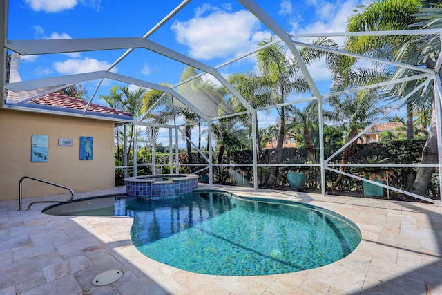 view of pool with an in ground hot tub, a lanai, and a patio