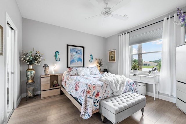 bedroom featuring hardwood / wood-style flooring and ceiling fan