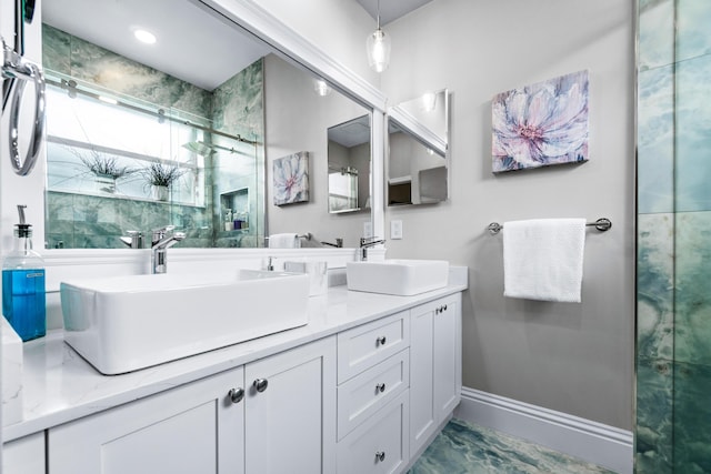 bathroom featuring vanity and an enclosed shower