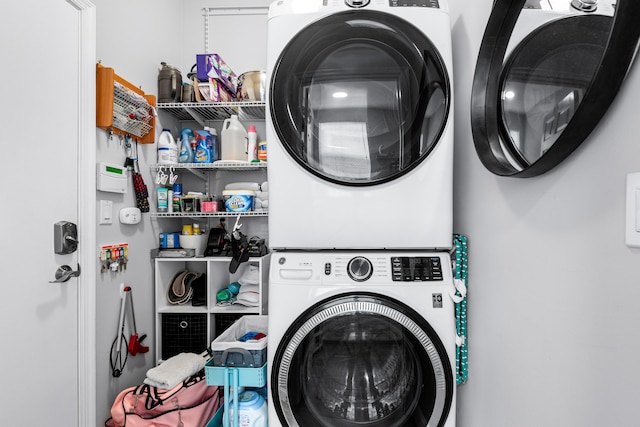 washroom with stacked washer and clothes dryer