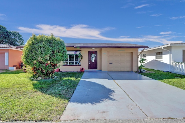 single story home with a front yard and a garage