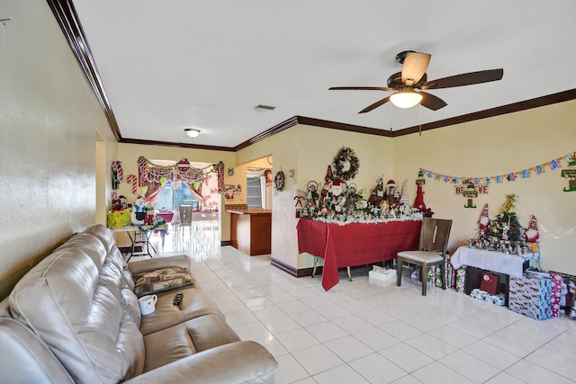 living room featuring ceiling fan, light tile patterned flooring, and ornamental molding