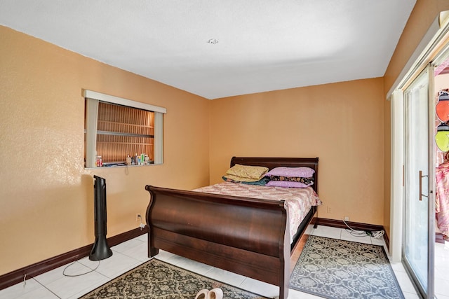 bedroom with light tile patterned floors