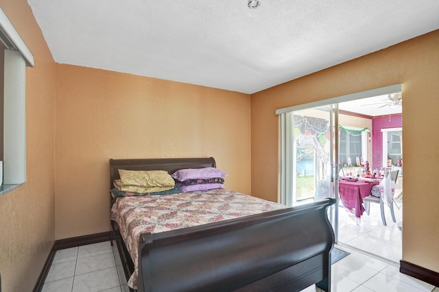 tiled bedroom featuring a textured ceiling