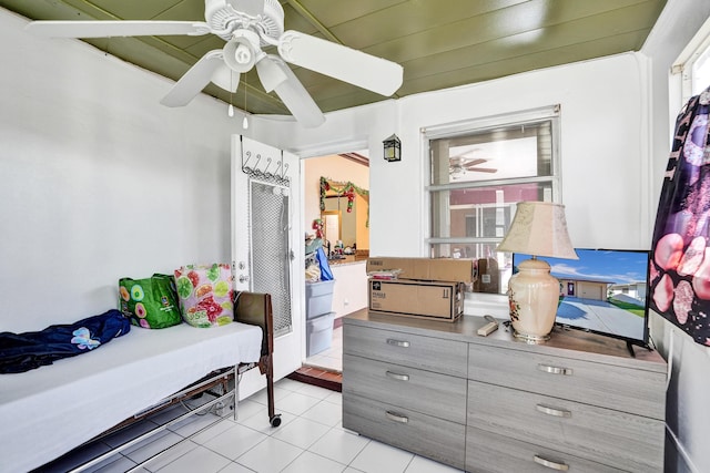 tiled bedroom with ceiling fan