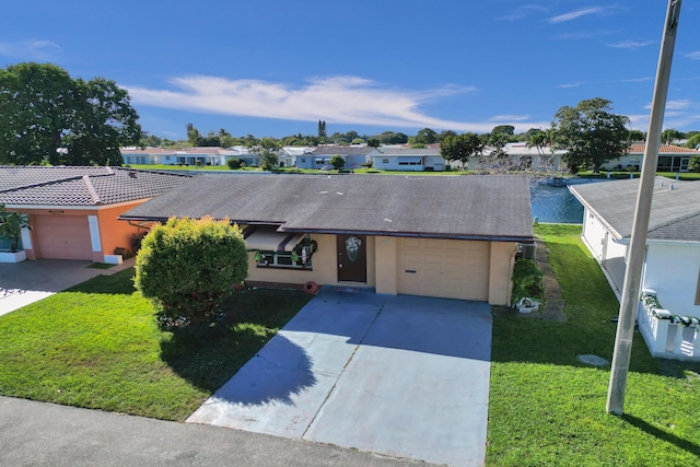 ranch-style house with a front yard and a garage