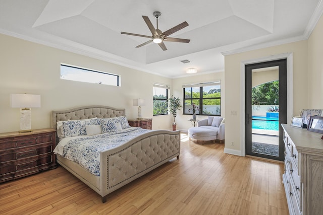 bedroom with access to outside, a raised ceiling, ceiling fan, and light hardwood / wood-style flooring