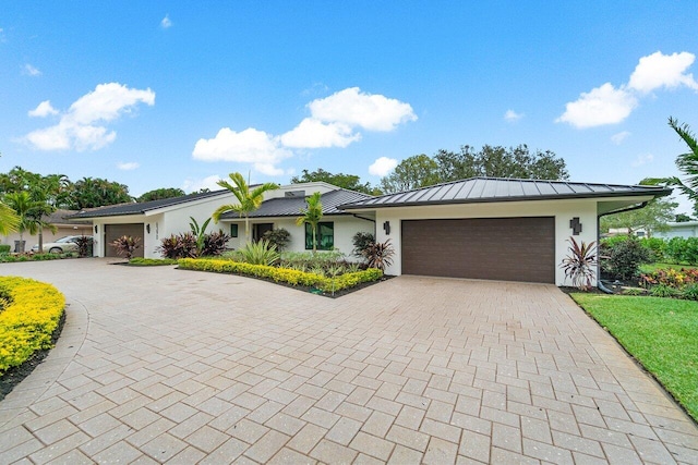 single story home with a garage