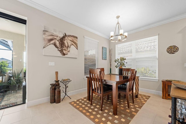 dining space with crown molding, light tile patterned flooring, and a chandelier