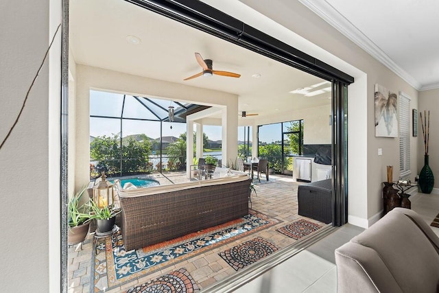 interior space featuring glass enclosure, ceiling fan, and an outdoor living space