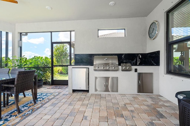 view of patio featuring area for grilling and exterior kitchen