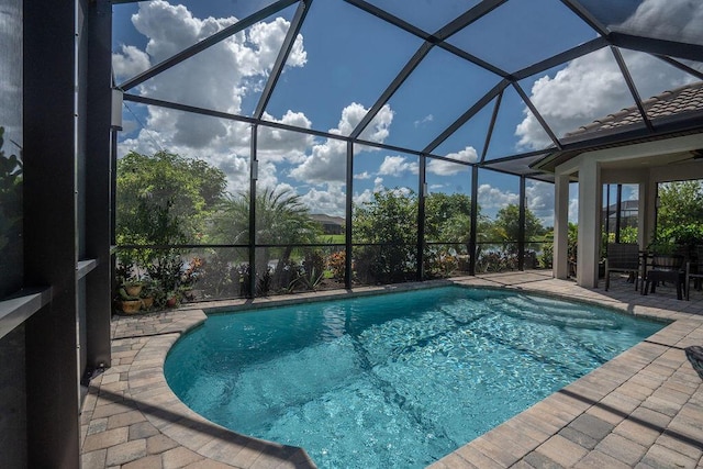 view of pool with a lanai and a patio area