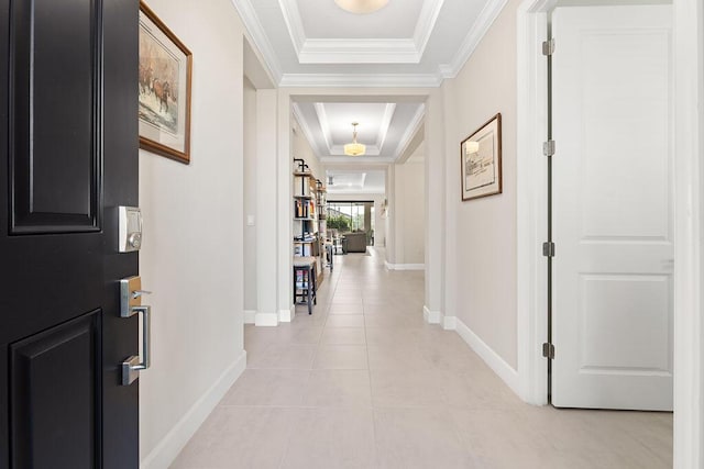 hallway featuring crown molding and light tile patterned floors