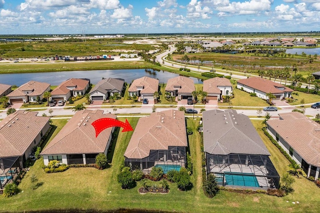 bird's eye view with a water view